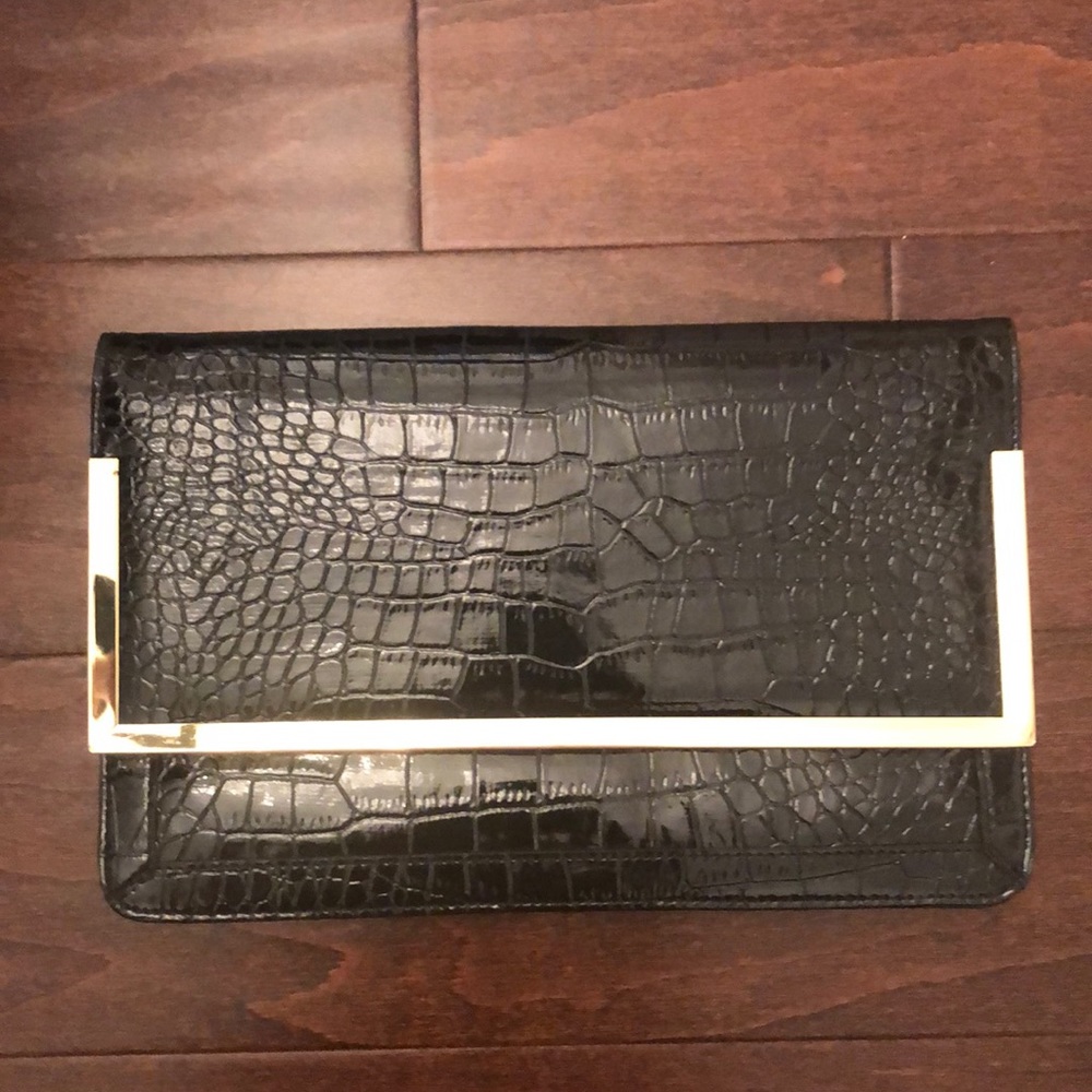 Women’s black clutch handbag